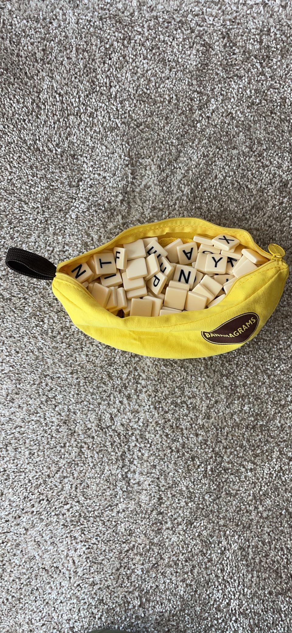Bananagrams Classic Word Game, 144 Tiles in Banana Pouch, Travel Game | Fast-paced spelling & anagram game for 1-8 players; portable pouch, educational wordplay for kids and adults ages 7+ customer photo 1