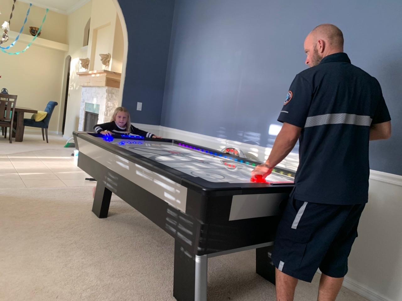 Atomic Top Shelf 7.5ft Air Hockey Table with LED Lighting | 120V motor, high-speed PVC surface. LED Lumen-X multicolor lighting and music. Includes LED pushers and hexagonal puck. customer photo 2