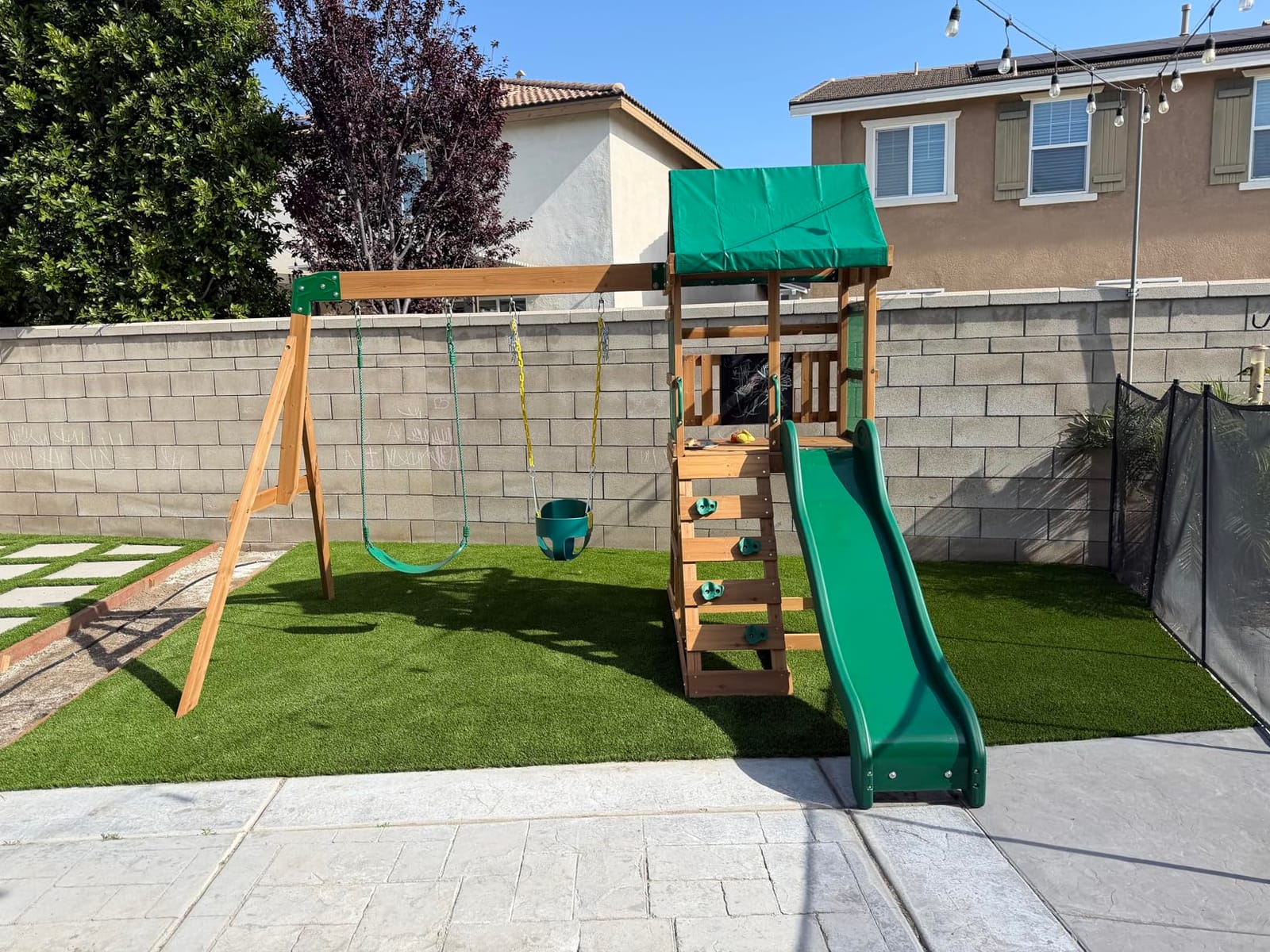 Backyard Discovery Buckley Hill Cedar Wood Swing Set with Wave Slide, Play Deck, Rock Wall Ladder, Belt Swings, Chalkboard, Canopy Roof, Outdoor Playset customer photo 1