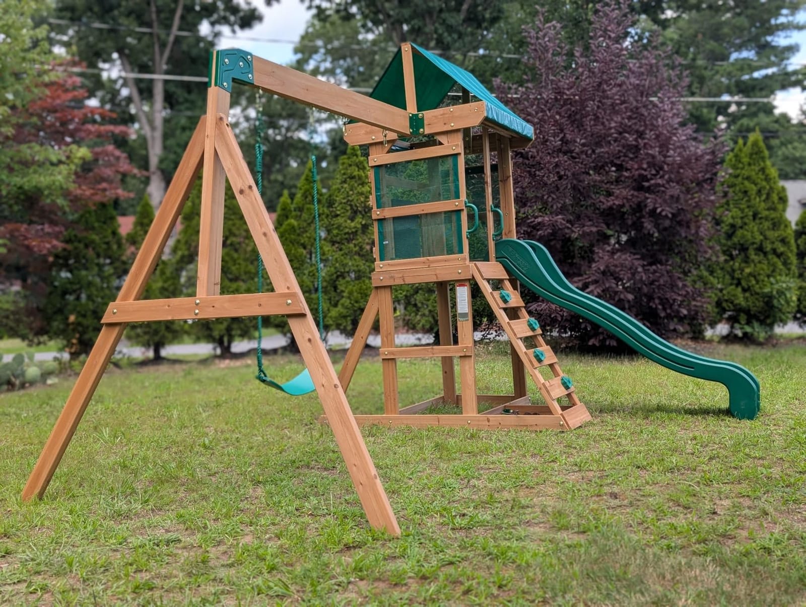 Backyard Discovery Buckley Hill Cedar Wood Swing Set with Wave Slide, Play Deck, Rock Wall Ladder, Belt Swings, Chalkboard, Canopy Roof, Outdoor Playset customer photo 2