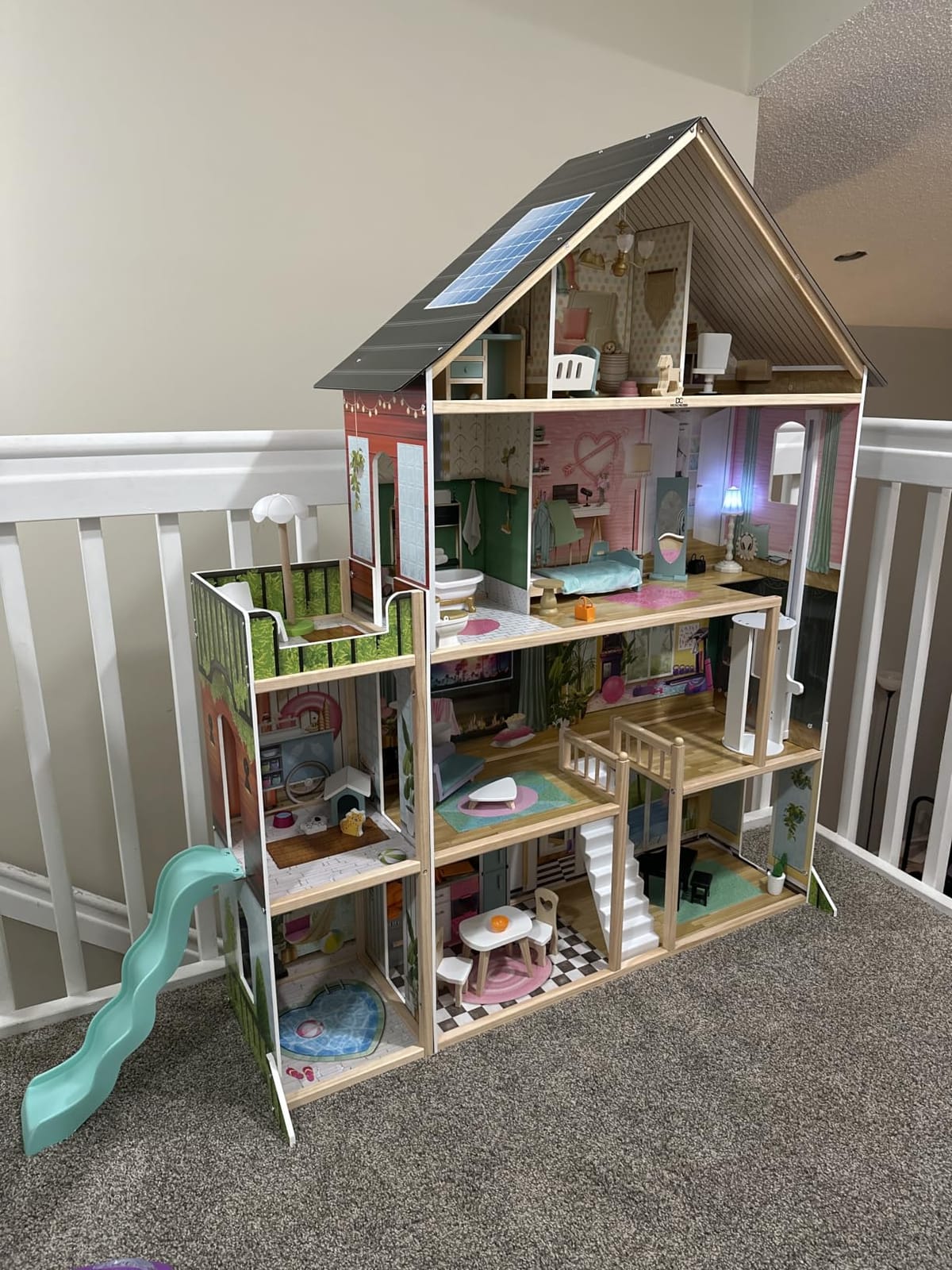Delta Children Deluxe Maui Dollhouse - Large 4-Story Dollhouse with 12 Rooms Includes 50 Accessories - Working Elevator, Wave Slide, Lights/Sounds - Fits 12-inch Dolls - Pretend Play Gift for Ages 3+ customer photo 1